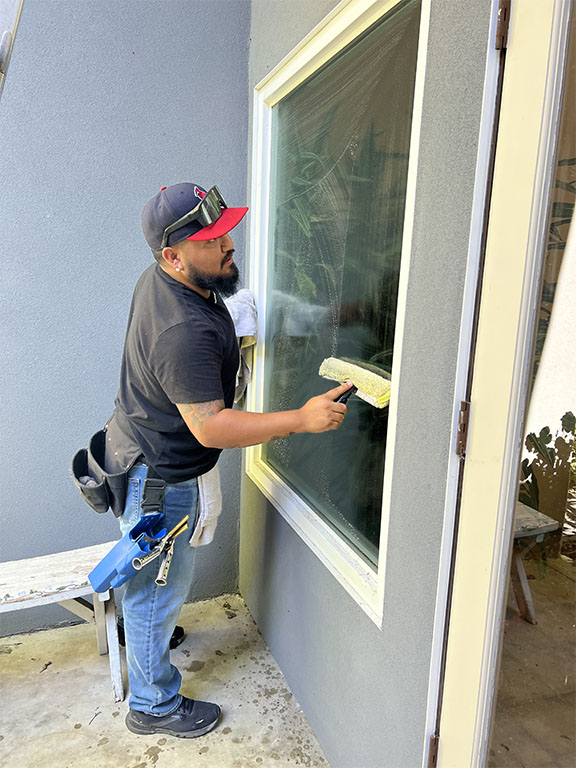 Elihu-cleaning-windows Elihu Soto washing exterior window